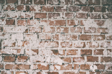 Background of old vintage dirty brick wall with plaster,  Brick wall background texture with faded effect, Painted distressed wall surface, Vintage red stonewall background