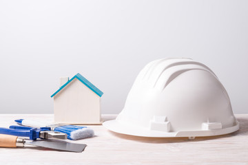 Building tools on wooden background.