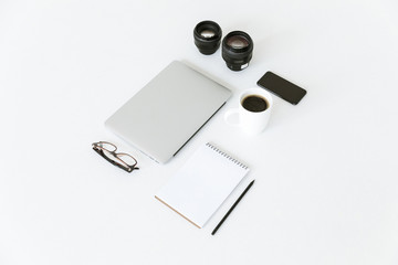 composition with laptop and camera lenses