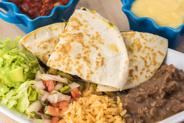 Spinach mushroom quesadillas with refried beans and rice.