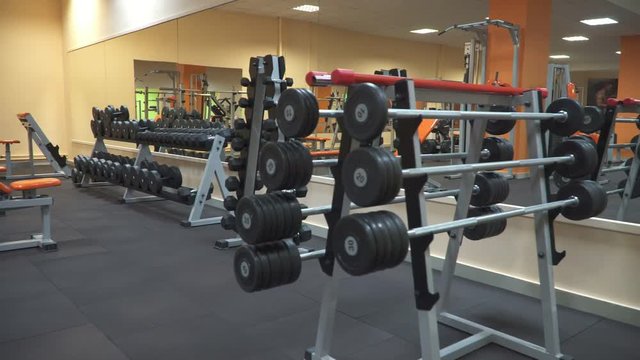 empty gym with equipment and free weights