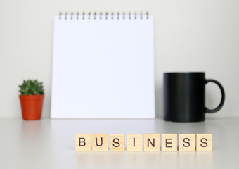 Business text made with wood blocks.Business Concept