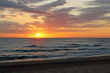 Fototapeta na wymiar sunrise on the beach a summer day
