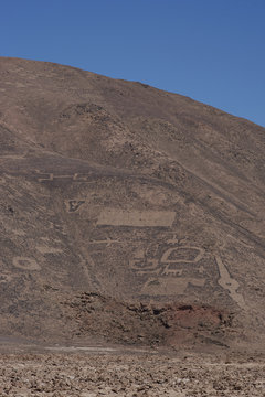 Large group of ancient petroglyphs on the hillsides at Cerro Pintados in the Atacama Desert in the Tarapaca Region of northern Chile. 