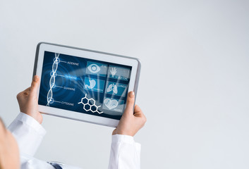 Close of female doctor hands working with tablet pc computer