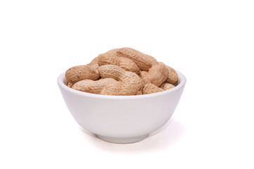 Peanuts in a white cup on a white background