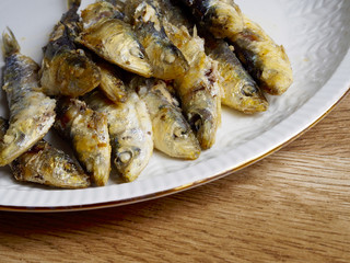 Fried small sardine on a plate