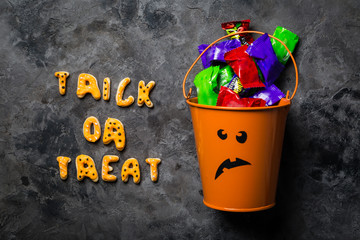 Halloween concept - basket with candies
