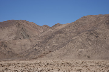 Large group of ancient petroglyphs on the hillsides at Cerro Pintados in the Atacama Desert in the Tarapaca Region of northern Chile. 