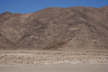 Large group of ancient petroglyphs on the hillsides at Cerro Pintados in the Atacama Desert in the Tarapaca Region of northern Chile. 