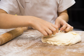 Production of flour products. Hands close up