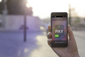 Woman using contemporary modern smartphone to make an online payment. Shopping online concept