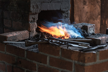 blacksmith forge sucking in flames and smoke