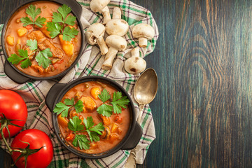 Stew soup with meat, potatoes, mushrooms and red pepper