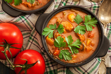 Stew soup with meat, potatoes, mushrooms and red pepper