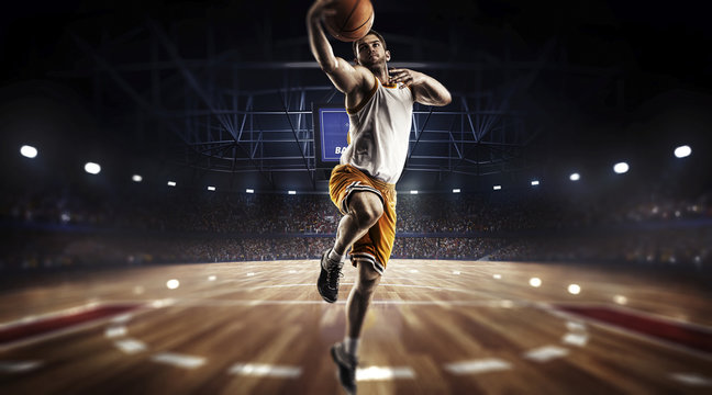 one basketball player jump in stadium panorama view