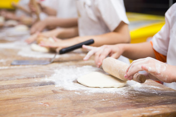 Production of flour products. Hands close up
