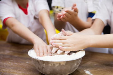 Obraz na płótnie Canvas Production of flour products. Hands close up
