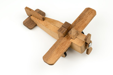 isolated wooden toy airplane , travel flight transport object on white background