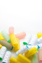 Mass of hair curlers isolated on white background