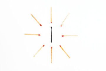 burned with new wooden match sticks on white background. Different Concept