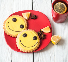 Cup of hot tea with lemon and cookies
