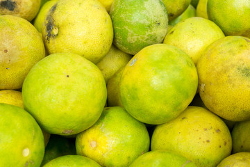 many ripe yellow lime for background