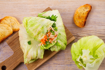 Lettuce wraps with chicken, carrot, peanuts and ginger-scallion oil. View from above, top, horizontal