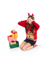 woman in sweater and christmas presents