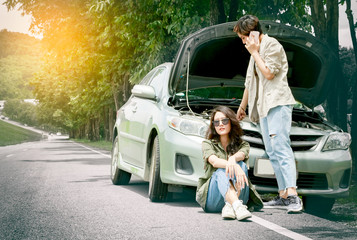 Woman calling for help after her car breakdown