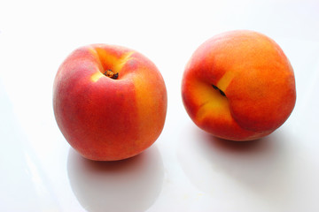 Peaches on a white background fresh fruit health food vitamins