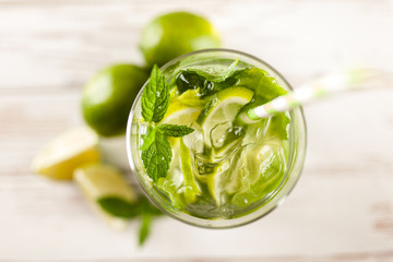 Mojito cocktail on white wood background