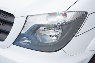 headlight of modern prestigious van suv close up of car