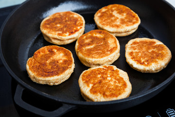 Delicious fried syrniki close-up. Traditional in Russia, Ukraine and Belarus quark pancakes