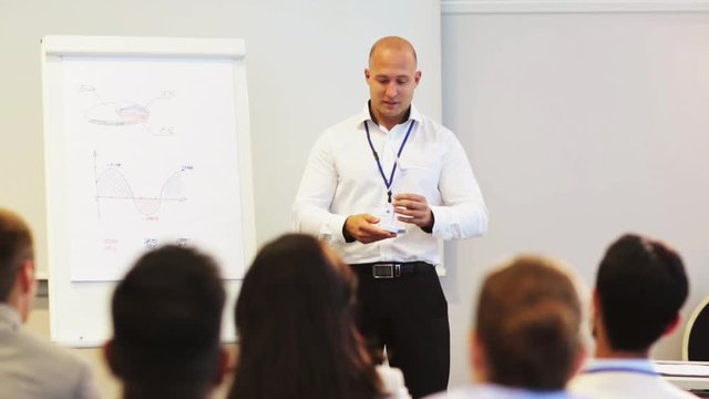 speaker with wind turbine at business conference