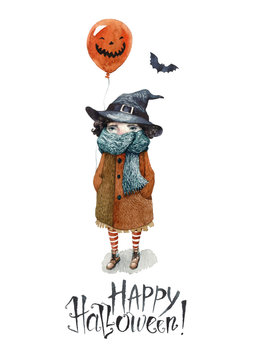 A Happy Halloween postcard painted in watercolor. A little girl in a coat and a scarf, with bat wings on her back, witch hat on her head and a balloon behind her. Hand-painted letters Happy Halloween!
