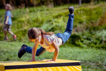 Girl Child Practicing Parkour Gymnastics Outside