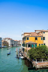 Fototapeta na wymiar Tourists on water street with Gondola in Venice, ITALY