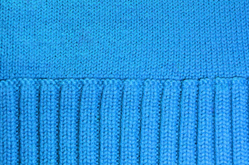 Texture of blue woolen knitted background