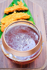 Fried slices of the ripe BANANA also called Pisang Goreng, which are eaten as snack or used to accompany dishes in Malaysia with honey  on the table.