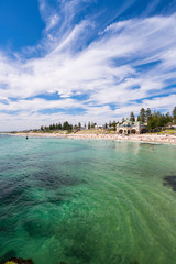 Cottesloe Beach on a warm Spring day with high cloud. Perth, Western Australia, Australia.