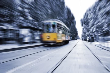 Gordijnen Blurred movement of a Old vintage orange tram © pbombaert