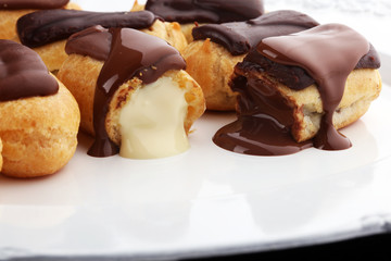 Traditional French dessert. Eclair with chocolate icing. Pastery concept