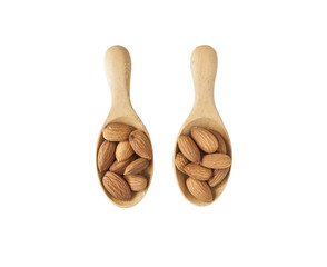 isolated almond in wooden spoon on white background