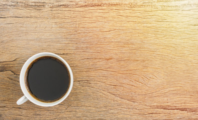 Cup of coffee on wooden table