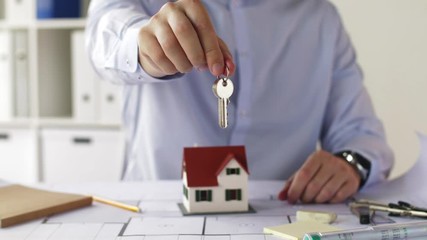 close up of architect with house keys at office - Powered by Adobe