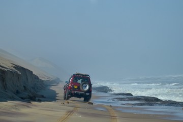 Driving on the beach in Namibia