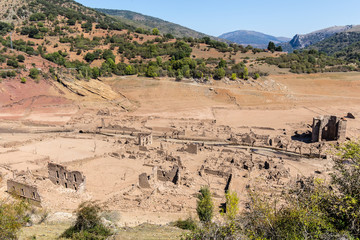 Fototapeta na wymiar Ancient village engulfed in Mansilla de la Sierra, Spain, reappearing due to the persistent drought