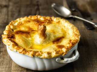 close up of golden rustic english chicken pie