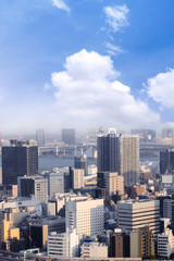 Fototapeta na wymiar Cityscapes of Tokyo, city aerial skyscraper view of office building and downtown and street of minato in tokyo with blue sly and clouds background. Japan, Asia